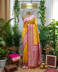 Mustard yellow patola silk saree with rani pink border