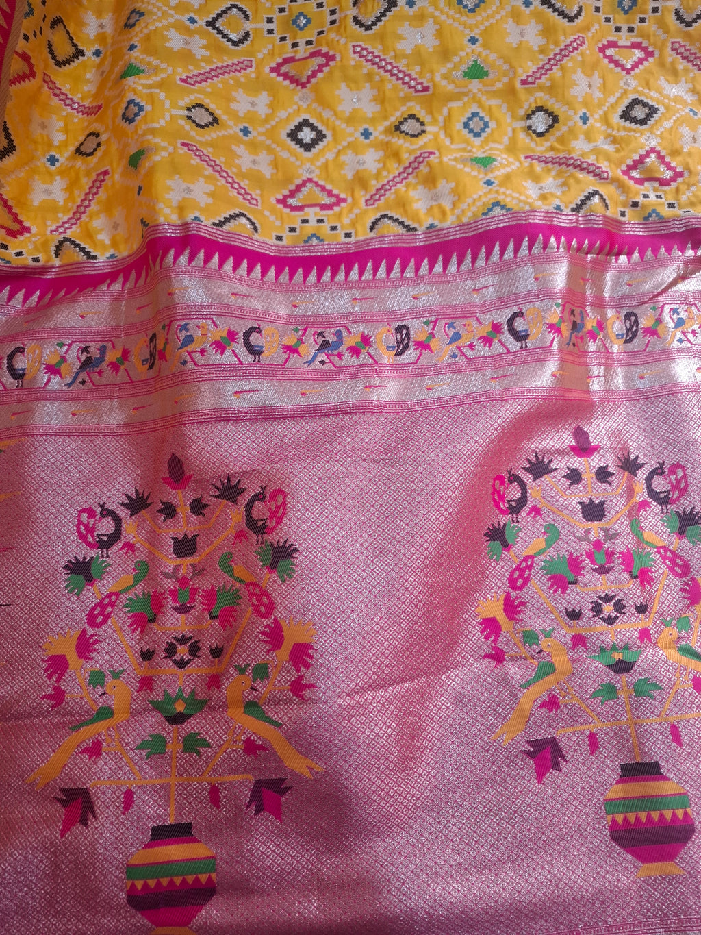 Mustard yellow patola silk saree with rani pink border