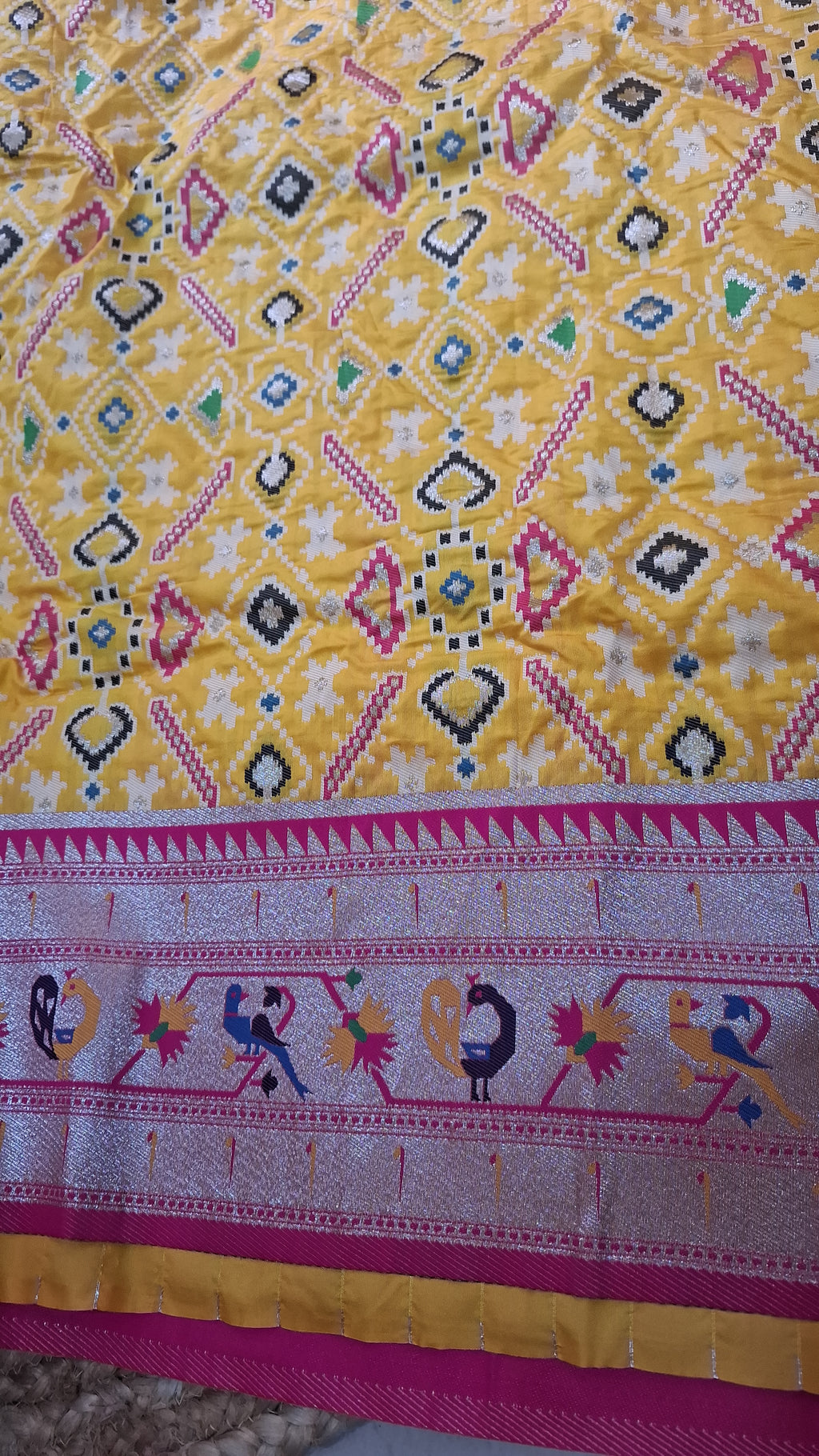Mustard yellow patola silk saree with rani pink border