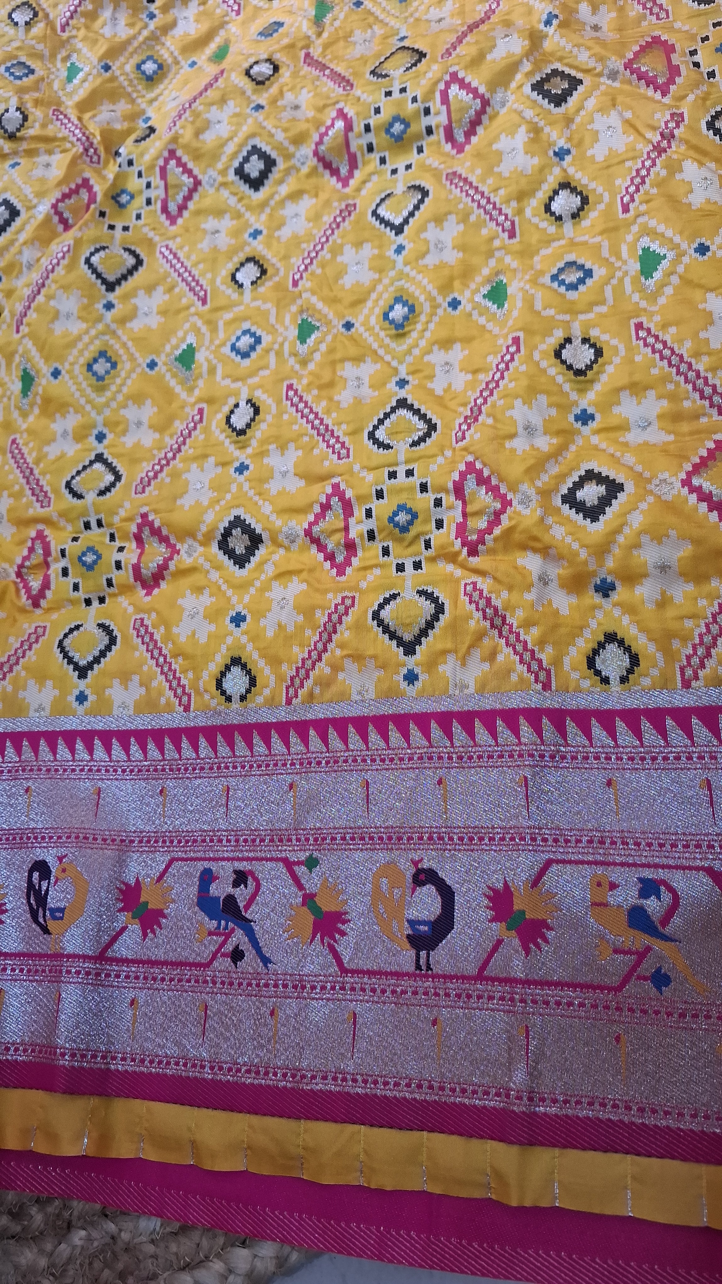 Mustard yellow patola silk saree with rani pink border