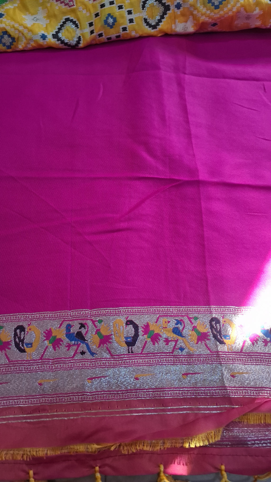Mustard yellow patola silk saree with rani pink border