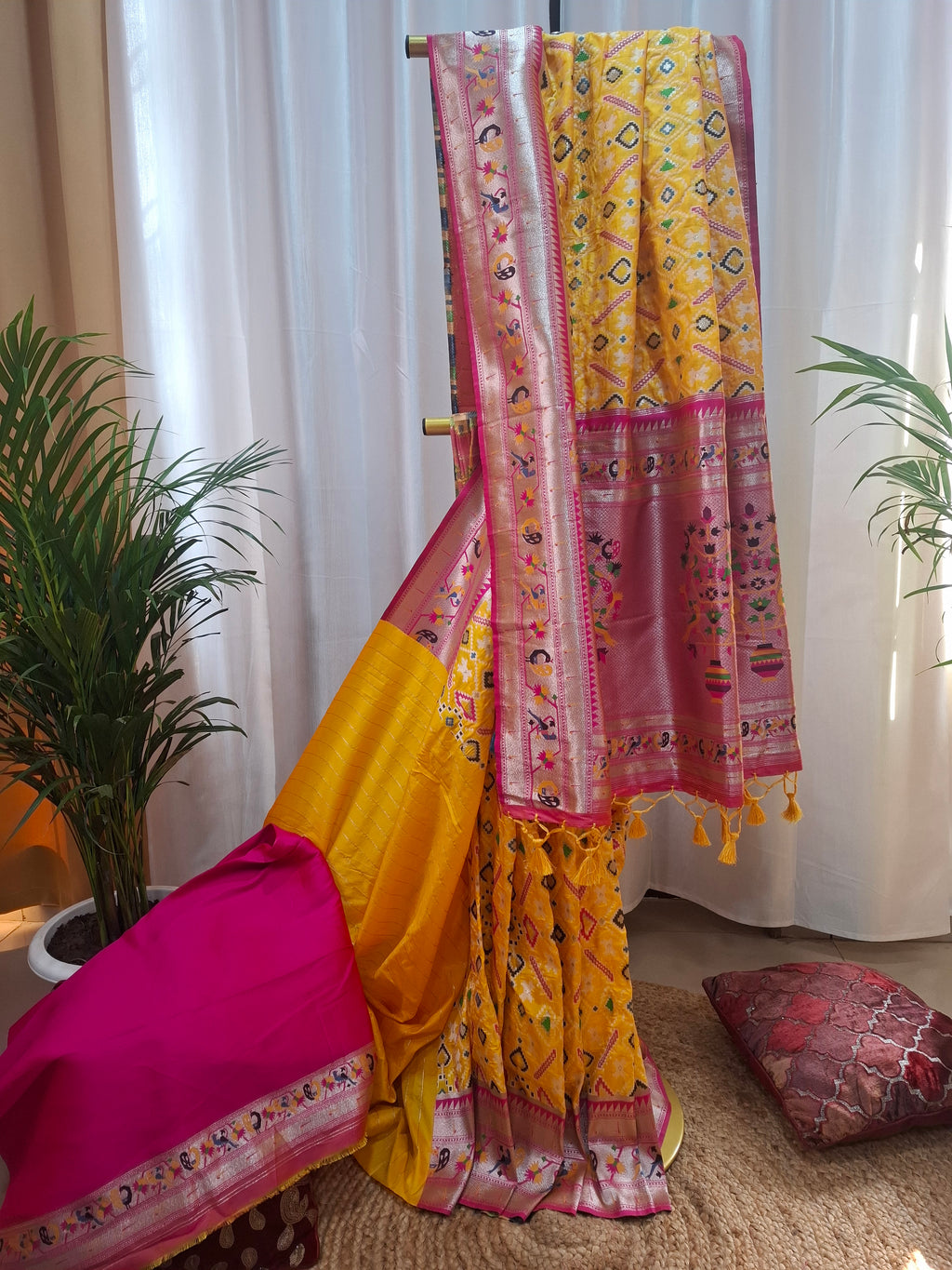 Mustard yellow patola silk saree with rani pink border