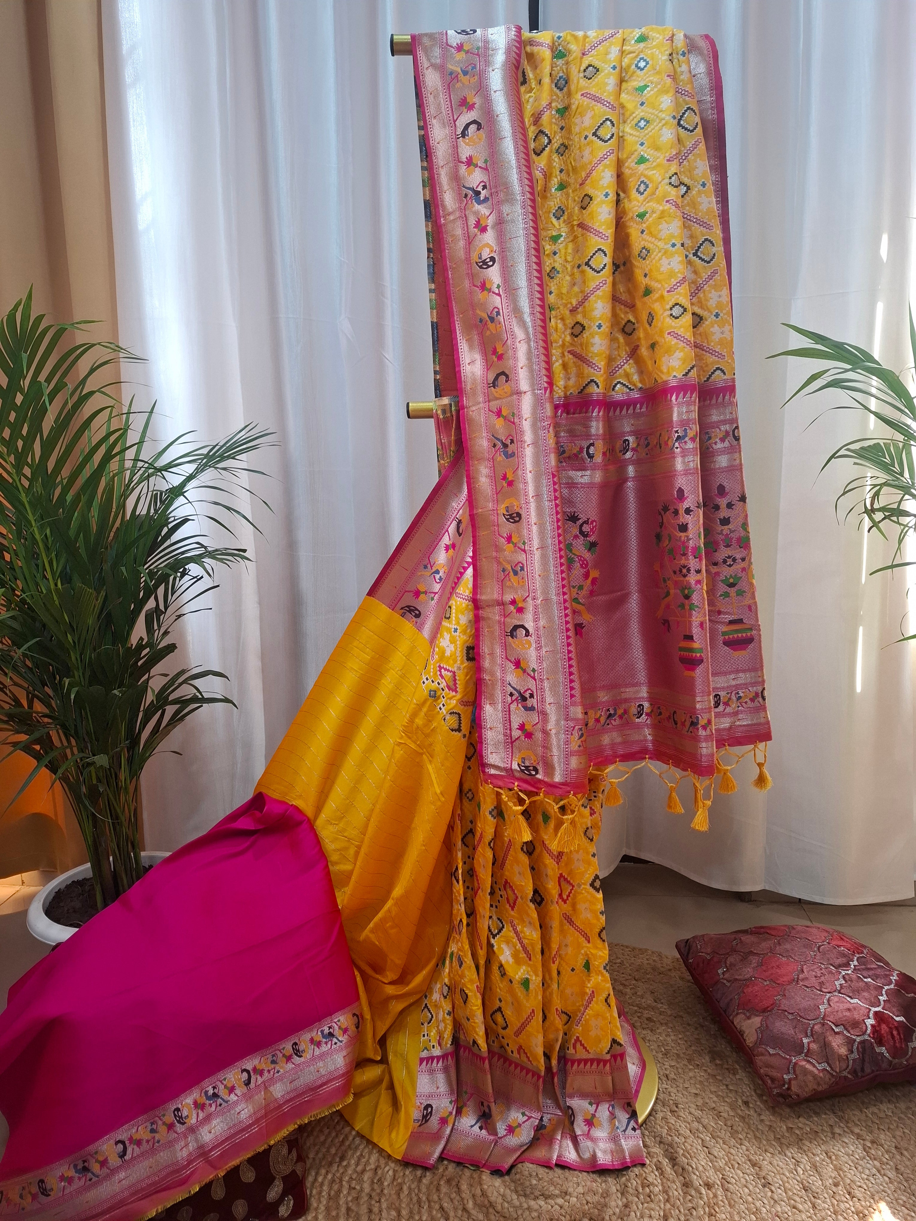 Mustard yellow patola silk saree with rani pink border