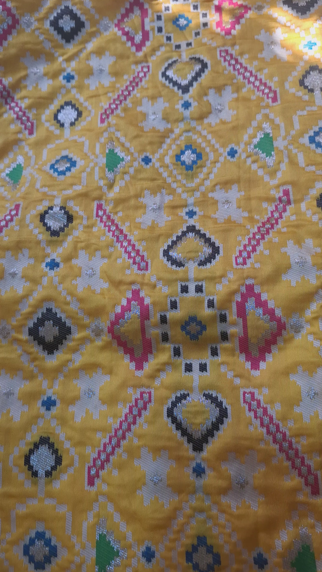 Mustard yellow patola silk saree with rani pink border