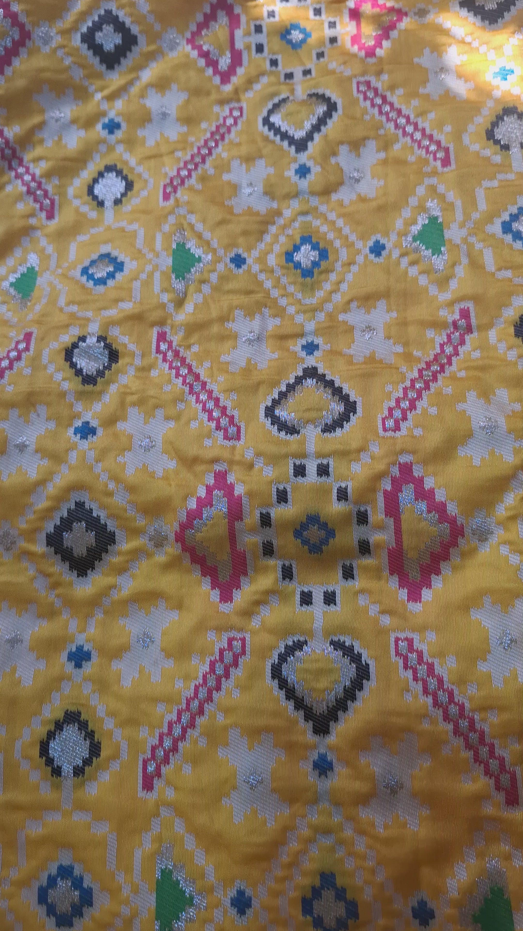 Mustard yellow patola silk saree with rani pink border